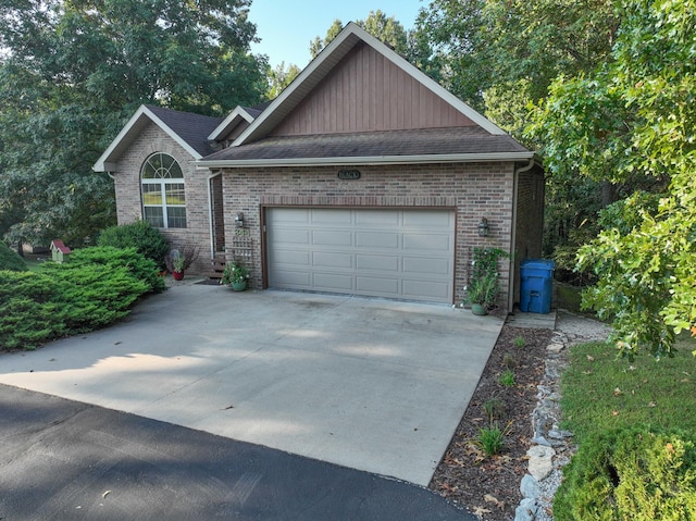 view of side of home featuring a garage