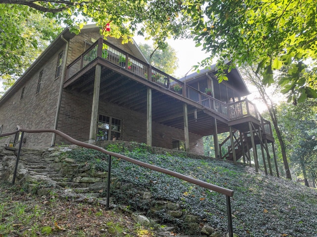 exterior space with a sunroom and a deck