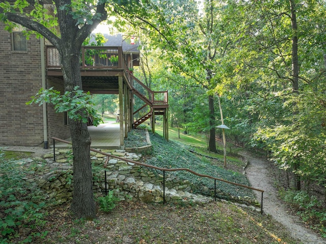 view of yard featuring a wooden deck