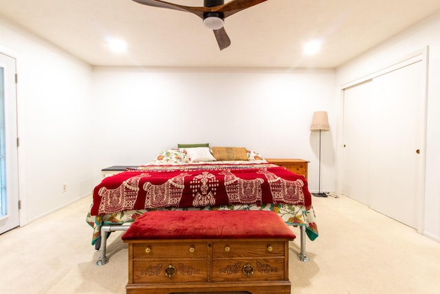 carpeted bedroom featuring ceiling fan