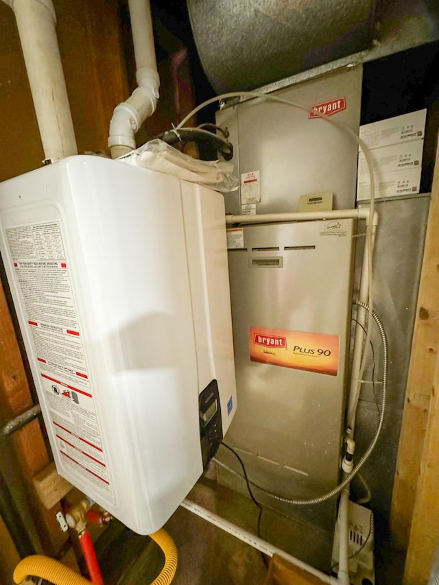 utility room featuring tankless water heater