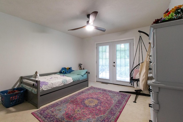 bedroom with ceiling fan, light carpet, access to outside, and french doors