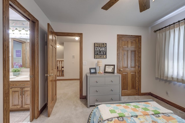 bedroom with ceiling fan and light carpet