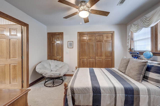 bedroom with light carpet, a closet, and ceiling fan