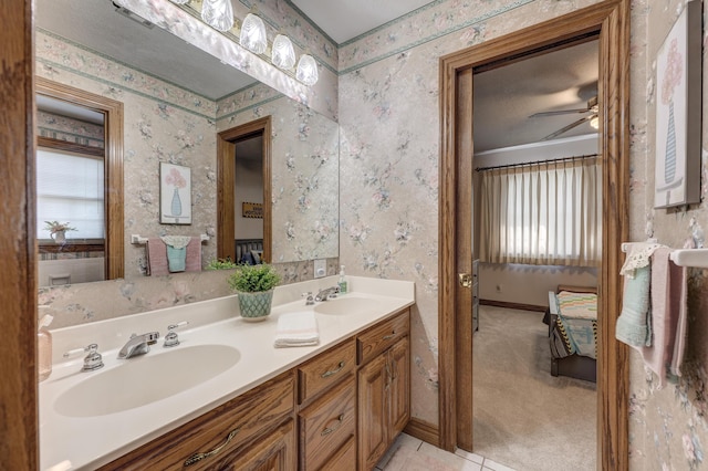 bathroom featuring tile patterned flooring, vanity, and ceiling fan