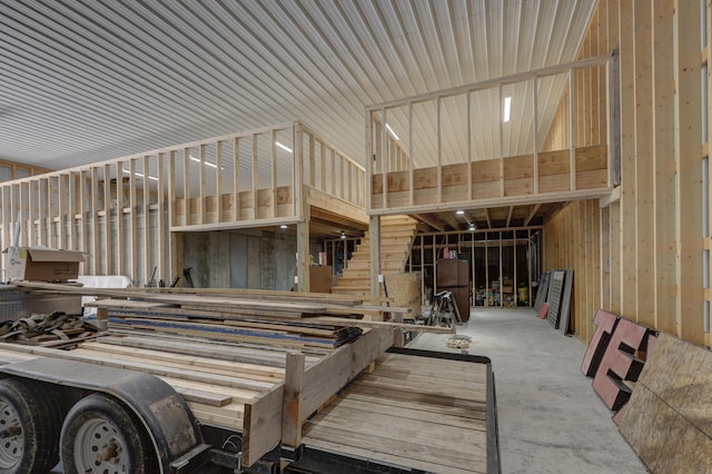 interior space with wooden walls and concrete floors