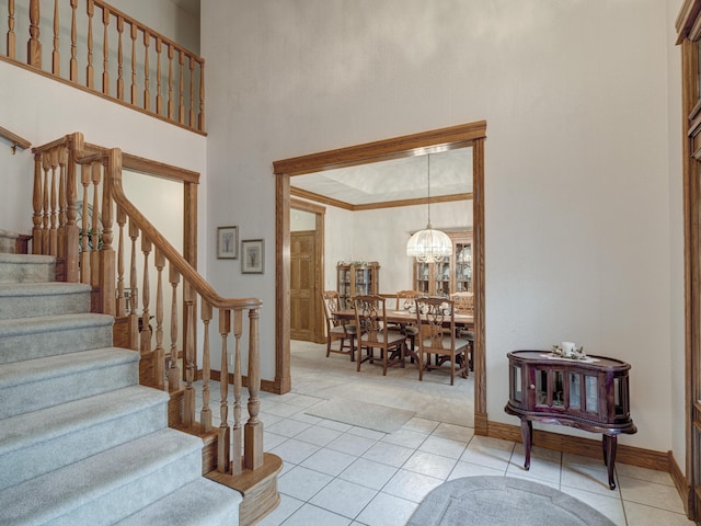 foyer entrance featuring light tile patterned floors and a chandelier