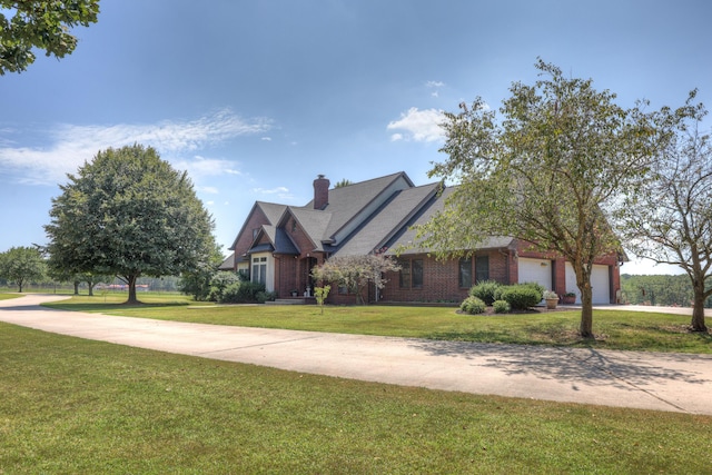 view of front facade with a garage and a front yard