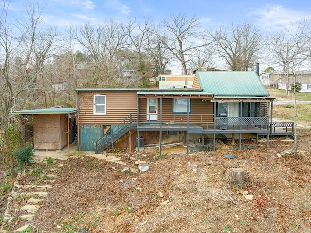 29 Adams Ln, Blue Eye, MO 65611 - back of property featuring stairway, a metal roof, and a porch