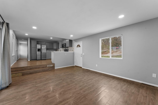 29 Adams Ln, Blue Eye, MO 65611 - unfurnished living room with dark wood-style floors and recessed lighting