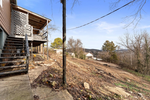 view of yard featuring a wooden deck