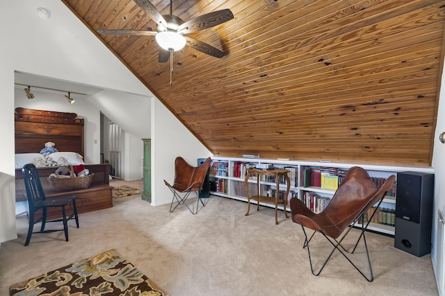 sitting room with ceiling fan, light colored carpet, wood ceiling, and lofted ceiling