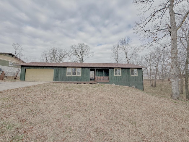 single story home featuring a porch and a garage