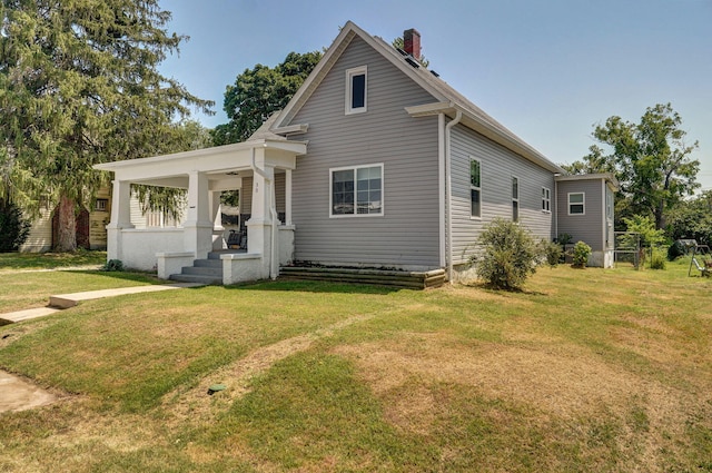 view of front of house featuring a porch and a front yard