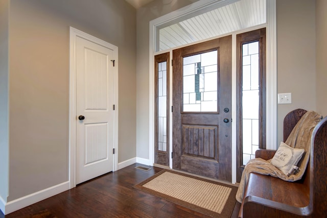 foyer entrance with dark wood-type flooring