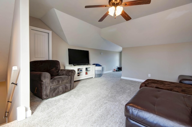 carpeted living room with ceiling fan and lofted ceiling