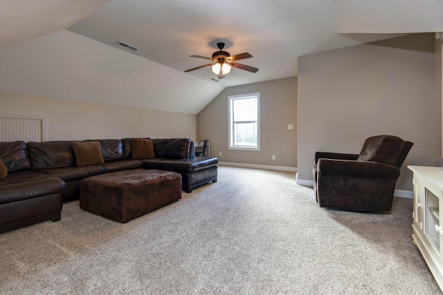 carpeted living room featuring vaulted ceiling and ceiling fan