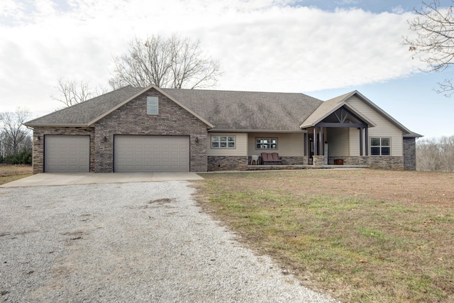 view of front of property with a garage and a front lawn