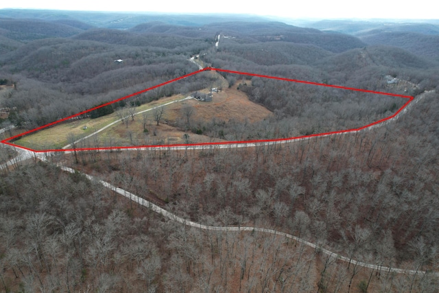 drone / aerial view with a mountain view and a rural view