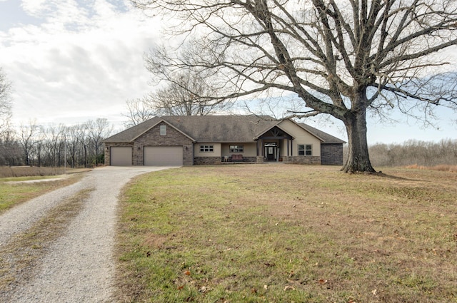 single story home with a garage and a front lawn