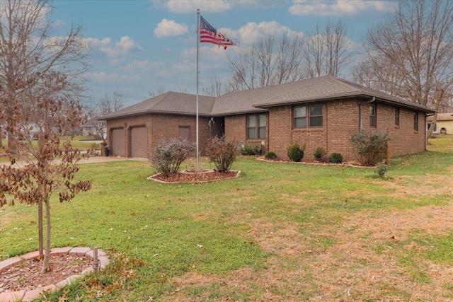 single story home featuring a front lawn and a garage