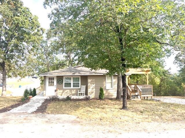 view of front of house featuring a wooden deck