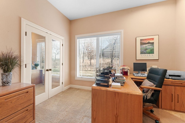 carpeted office space with french doors