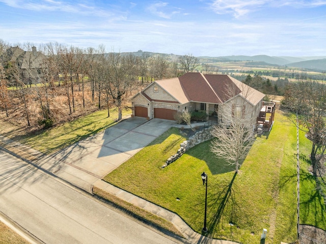 drone / aerial view featuring a mountain view