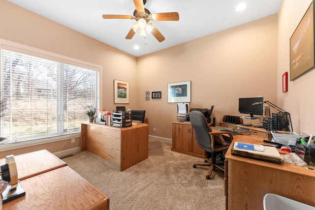 office area with light carpet and a healthy amount of sunlight