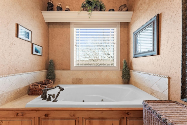 bathroom featuring a tub to relax in