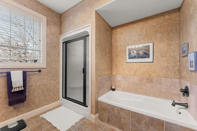 bathroom with tile patterned floors and plus walk in shower