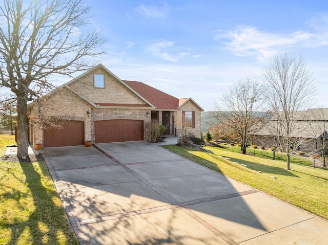 view of front facade with a front yard and a garage