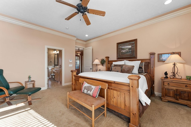 carpeted bedroom featuring ceiling fan, crown molding, and ensuite bathroom