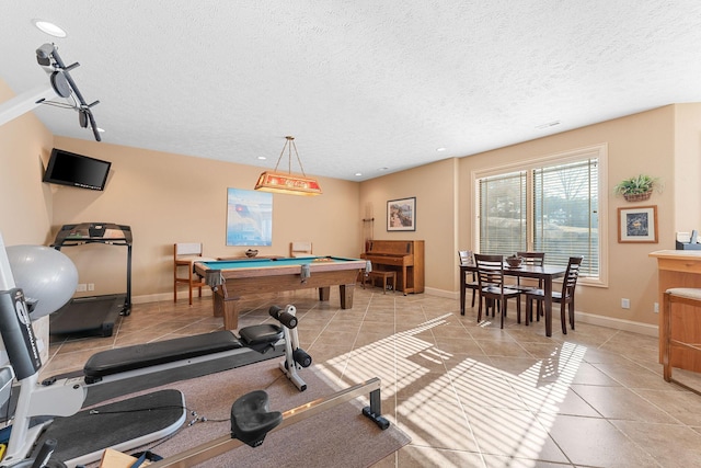 playroom featuring light tile patterned floors, a textured ceiling, and billiards