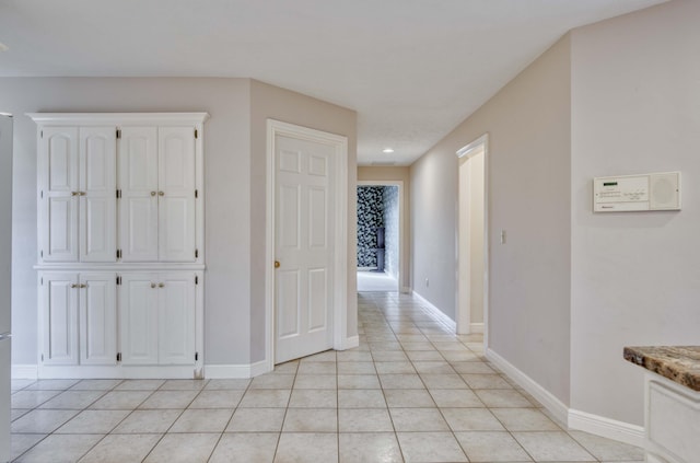 hallway featuring light tile patterned floors