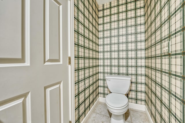 bathroom featuring tile patterned flooring and toilet