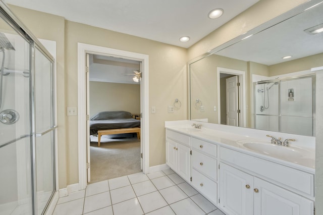 bathroom featuring tile patterned flooring, vanity, ceiling fan, and walk in shower