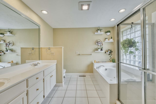 full bathroom with tile patterned floors, vanity, independent shower and bath, and toilet