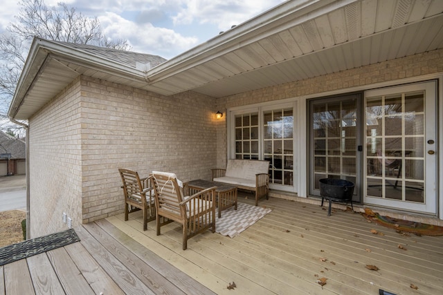 wooden deck featuring an outdoor hangout area