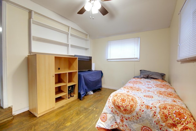 bedroom featuring lofted ceiling, hardwood / wood-style floors, and ceiling fan