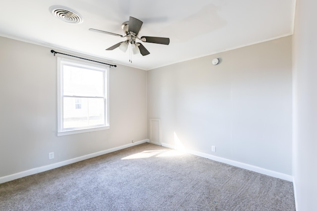 unfurnished room featuring visible vents, baseboards, carpet, and ceiling fan