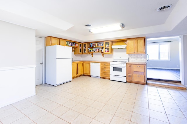 kitchen with white appliances, visible vents, premium range hood, open shelves, and a tray ceiling