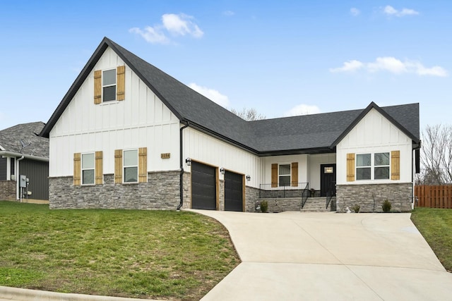 modern inspired farmhouse with a front lawn, covered porch, and a garage