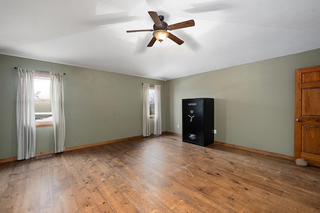 interior space with ceiling fan and wood-type flooring