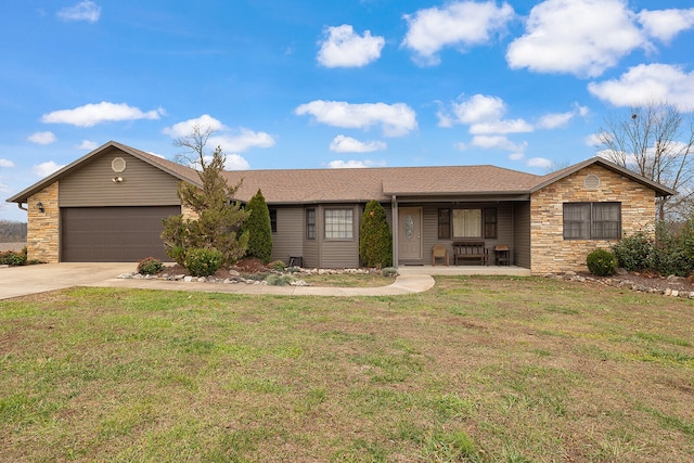 single story home featuring a porch, a garage, and a front lawn