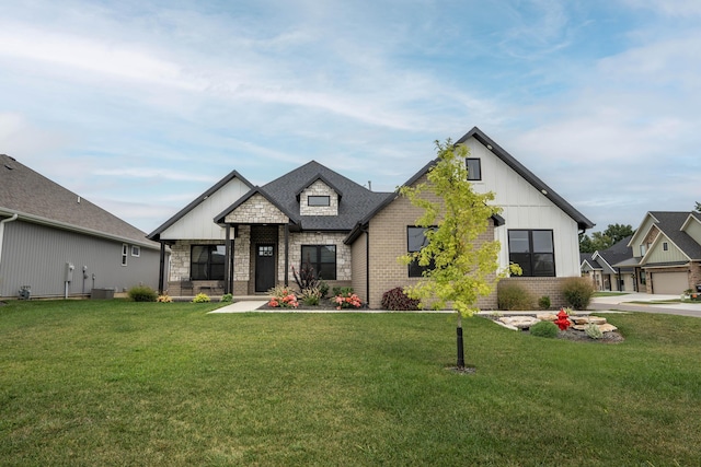 view of front of house with cooling unit and a front lawn