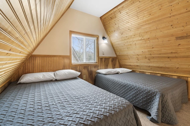 carpeted bedroom with vaulted ceiling and wood ceiling