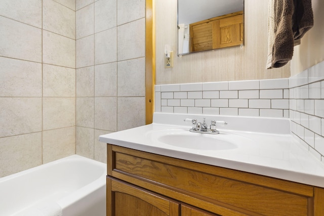 bathroom featuring tasteful backsplash and vanity