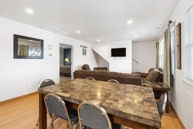 dining area featuring light wood-type flooring