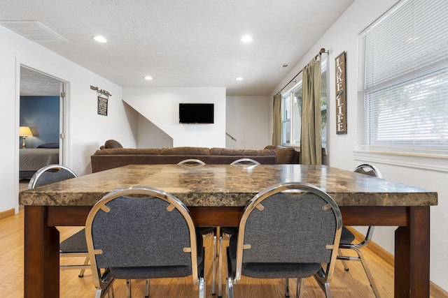 dining room with light wood-type flooring